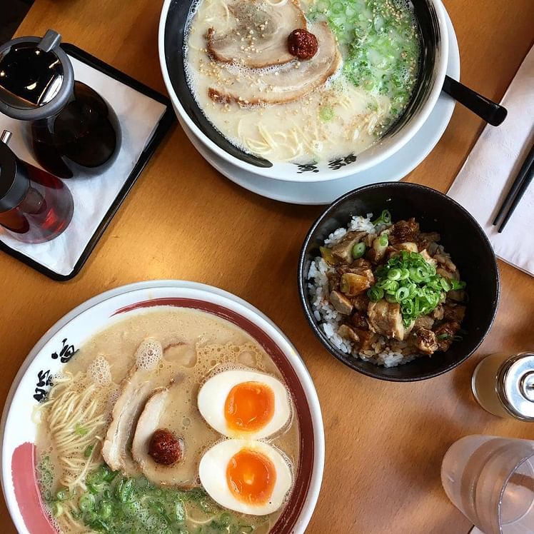 ramen bowls with eggs, broth, chasiu and side dish
